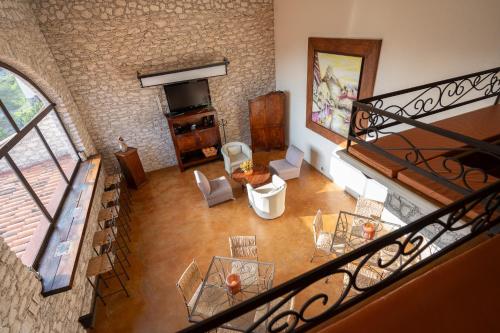 an overhead view of a living room with a staircase at El Cantar del Viento- Hotel Boutique in Bernal