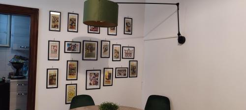 a wall with a bunch of pictures on it at RUDIAE Palace In Lecce in Lecce