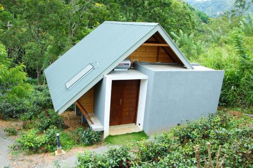 a small house with a tin roof at EllaCrest by Aloft in Kumbalwela