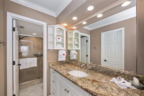 a bathroom with a sink and a shower at Pelican Watch #503 by Sun Palace Vacations in Fort Myers Beach