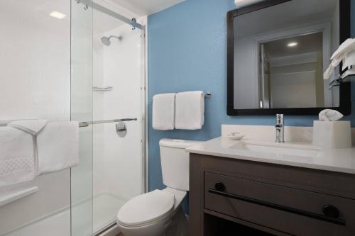 a bathroom with a toilet and a sink and a shower at Residence Inn Sunnyvale Silicon Valley II in Sunnyvale