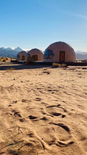 a group of domes in the middle of a desert at Marwan Rum Luxury Bubbles&Jeep Tour in Wadi Rum