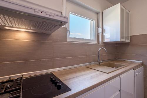 Kuchyň nebo kuchyňský kout v ubytování Apartment Orco