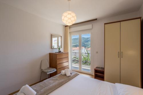 Postel nebo postele na pokoji v ubytování Apartment Orco
