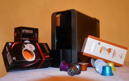 a table with a microwave and a box of coffee at Ferienwohnungen Perhofer in Birkfeld