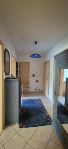 an empty living room with a room with a table at Tipp - Halle idyllisch am Fluss in Halle an der Saale
