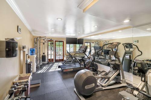 a gym with several treadmills and elliptical machines at Best Western Plus Carpinteria Inn in Carpinteria