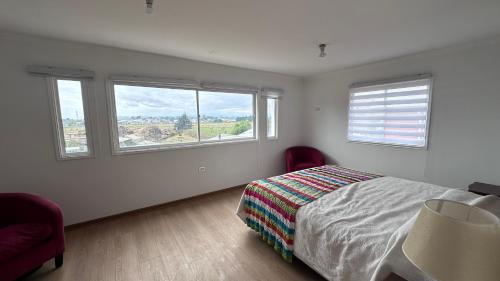 Postel nebo postele na pokoji v ubytování Cabaña H & M