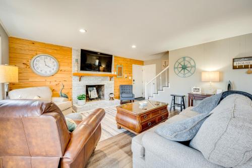 a living room with a couch and a fireplace at Private Boat Dock Troutman Home on the Water! in Terrell