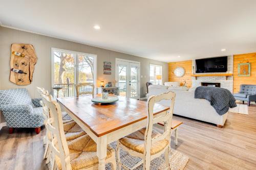 a dining room and living room with a table and a couch at Private Boat Dock Troutman Home on the Water! in Terrell