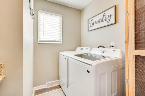 a laundry room with a washer and dryer at Private Boat Dock Troutman Home on the Water! in Terrell