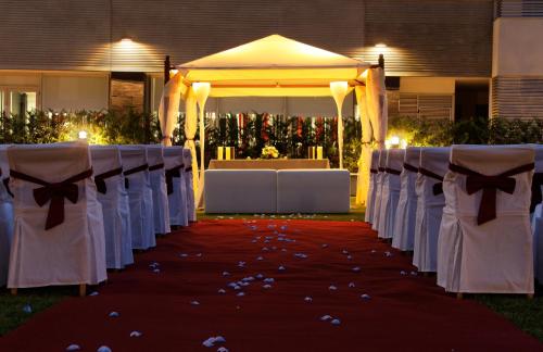 a set up for a wedding ceremony with a tent at Axor Feria in Madrid