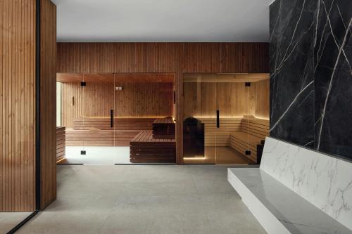 a room with wooden walls and wooden cabinets at The Isolano, Adults Friendly Resort, Autograph Collection - 12years and above in Cres