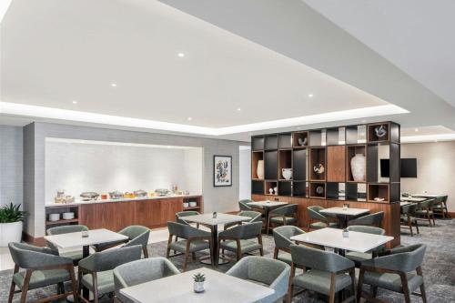 a dining room with tables and chairs at The Westin Buckhead Atlanta in Atlanta