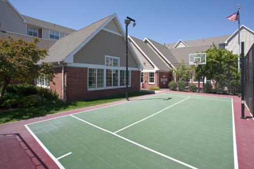 a tennis court in front of a house at Residence Inn Salt Lake City Airport in Salt Lake City