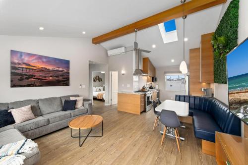 a living room with a couch and a table at Modern Newly Renovated 2BR Apt in Heart of Ocean Beach in San Diego