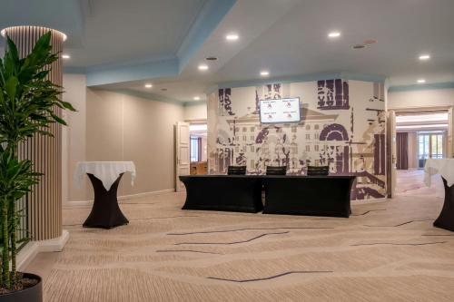 a conference room with a table and a screen at Munich Marriott Hotel in Munich
