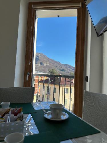 a table with a plate of food and a cup of coffee at La Gomonte in Civate