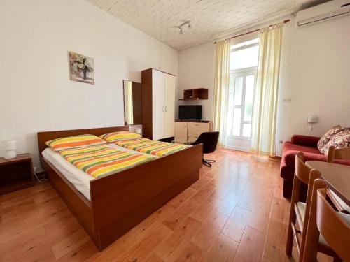 Postel nebo postele na pokoji v ubytování Apartments Jure