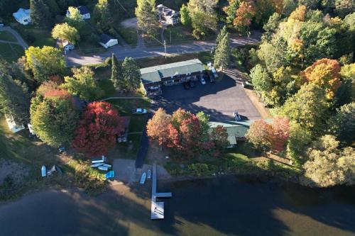 an overhead view of a large house with trees at Lakeshore Motel Ice Lake in Iron River