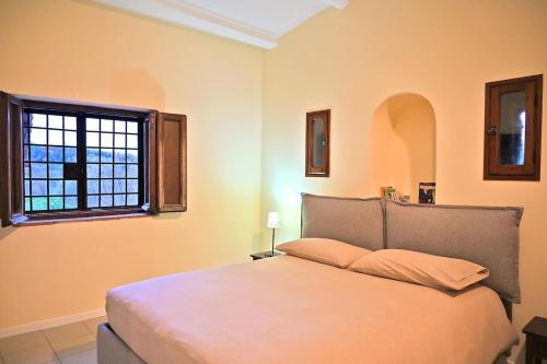 Ένα ή περισσότερα κρεβάτια σε δωμάτιο στο San Pastore Accommodation