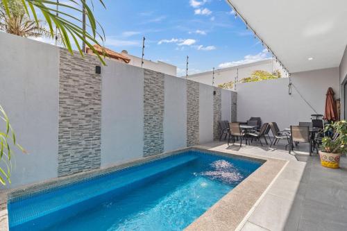 a swimming pool in the backyard of a house at Casa Bella Vacation Home in Puerto Vallarta