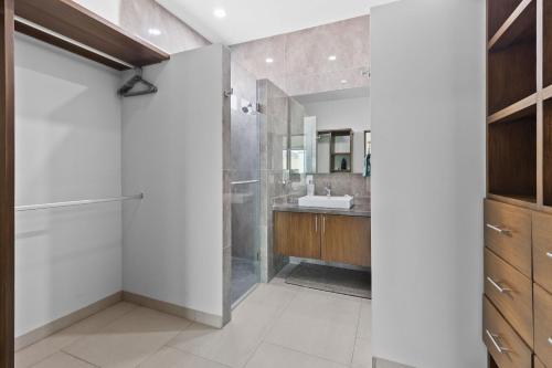 a bathroom with a glass shower and a sink at Casa Bella Vacation Home in Puerto Vallarta