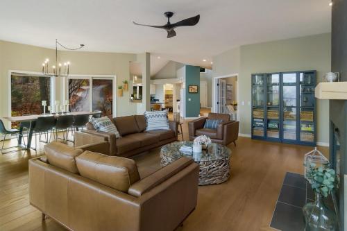a living room with a couch and a table at Luxury Estate Overlooking Water in Traverse City