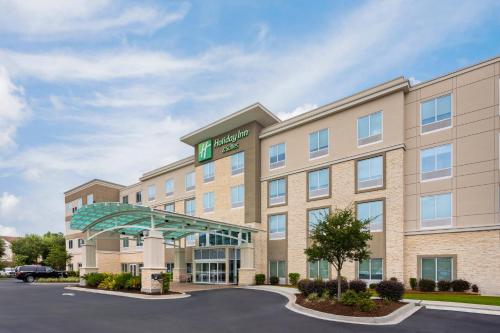 a rendering of a hotel in a parking lot at Holiday Inn & Suites - Savannah Airport - Pooler by IHG in Savannah