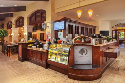 a restaurant with a food counter in a store at DoubleTree by Hilton Ontario Airport in Ontario