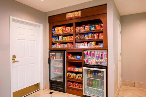 a food pantry with a refrigerator in a room at Residence Inn Kansas City Olathe in Olathe