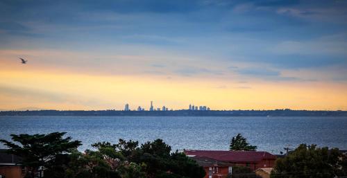 a bird flying over a large body of water at Quest Frankston on the Bay in Frankston