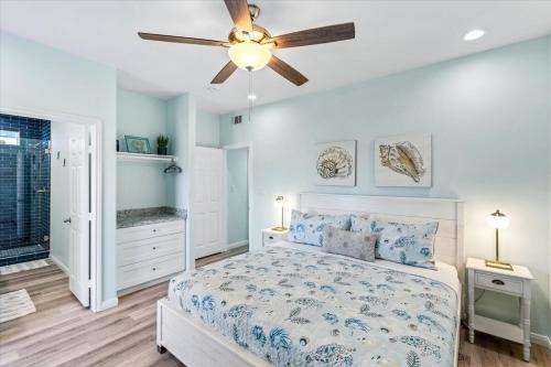 a bedroom with a bed and a ceiling fan at Mimosa Beach - Luxury Beachfront 5BR, Gorgeous views from multiple Decks in Gilchrist