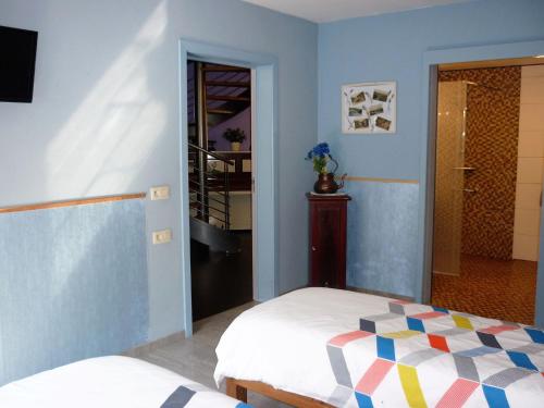 a bedroom with a bed and a door to a hallway at Belgium your low-cost stays in luxury gites in Hamoir