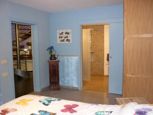 a bedroom with a bed and a walk in shower at Belgium your low-cost stays in luxury gites in Hamoir