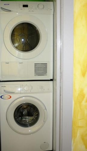 a washing machine and a dryer in a room at Belgium your low-cost stays in luxury gites in Hamoir