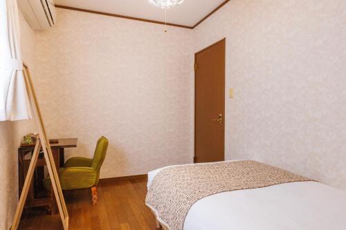 Postel nebo postele na pokoji v ubytování HOUSE KIRA