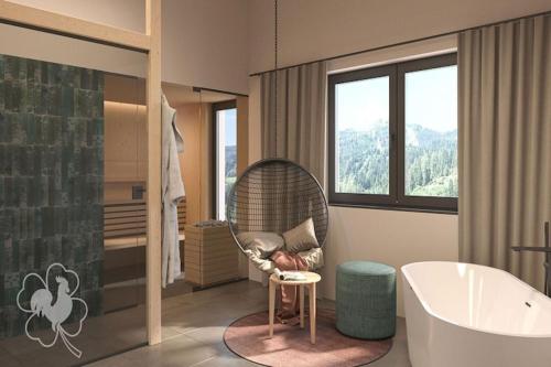 a bathroom with a chair and a tub and a shower at modernes Chalet in Hahnenklee in Hahnenklee-Bockswiese