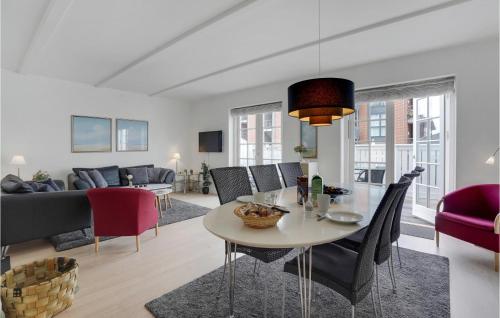 a living room with a table and chairs at Lovely Apartment In Gråsten With Sauna in Gråsten