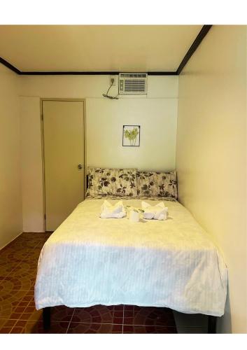 Postel nebo postele na pokoji v ubytování Trisha Guesthouse