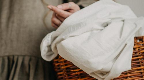 a person holding a basket with their hand at The Russell Boutique Hotel in Sydney