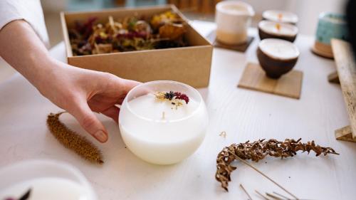 a person holding a glass of milk with a bee on it at The Russell Boutique Hotel in Sydney