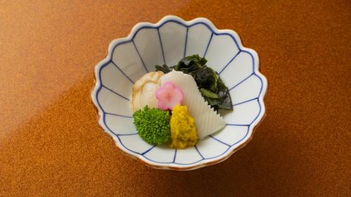 a plate of food on top of a table at Fujisan Ryokan in Hanamaki