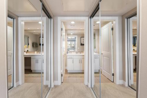 a bathroom with glass doors and a mirror at Charming Bliss By the Ocean LUXE 2bd 2ba MDR in Los Angeles