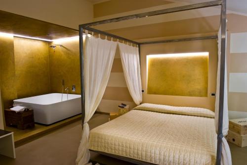 Katil atau katil-katil dalam bilik di Alessi Hotel Trattoria