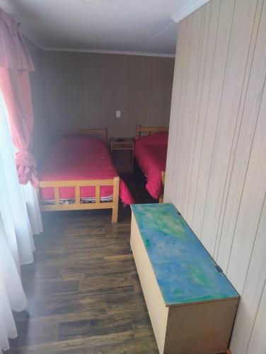 Кровать или кровати в номере Hostal y Residencial El Mundial