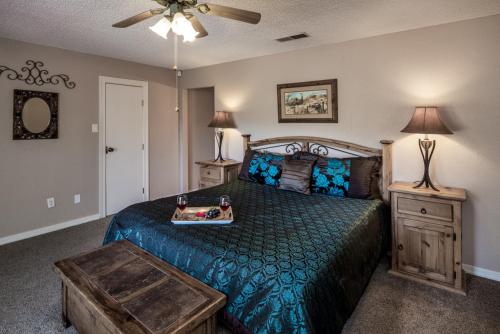 a bedroom with a bed with a tray on it at Amazing Place in Ruidoso