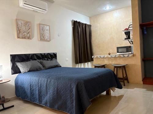 Ένα ή περισσότερα κρεβάτια σε δωμάτιο στο departamentos san juan 3