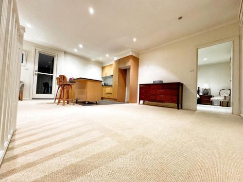 a large room with a kitchen with a dresser in it at Granny Unit Self Contained Double Storage WIFI POOL PARKING in Templestowe