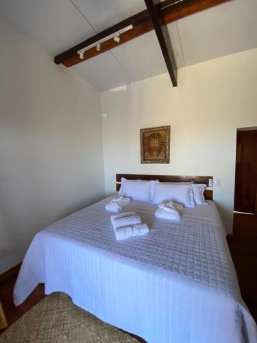 Postel nebo postele na pokoji v ubytování Aponem Spa & Pousada